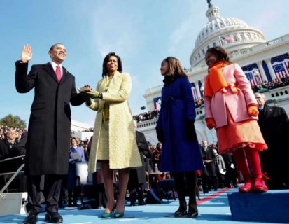 President Obama, with his family, getting inaugurated. First Black POTUS? Waitaminute, flag on the play!!